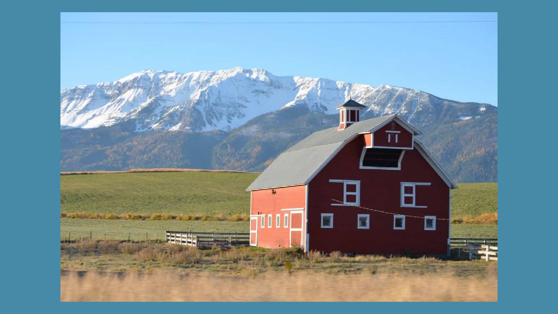 Big Red Barn with the Wallowa Mountains Eagle Cap Wilderness